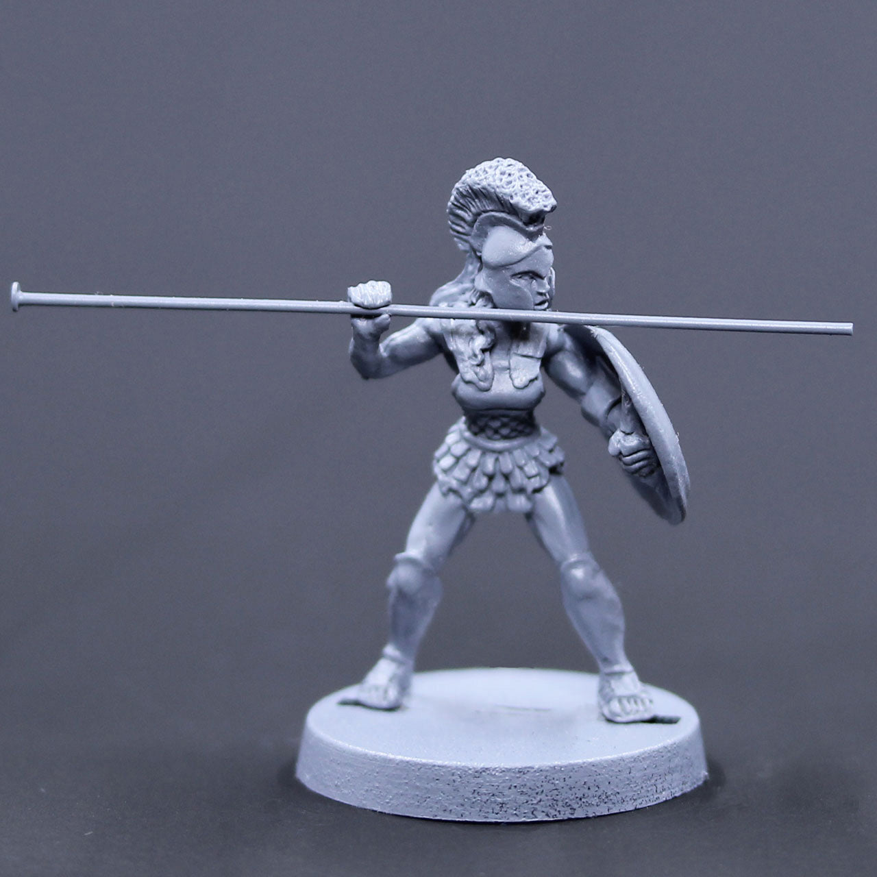 Amazon defending with spear and shield, crested helm 2