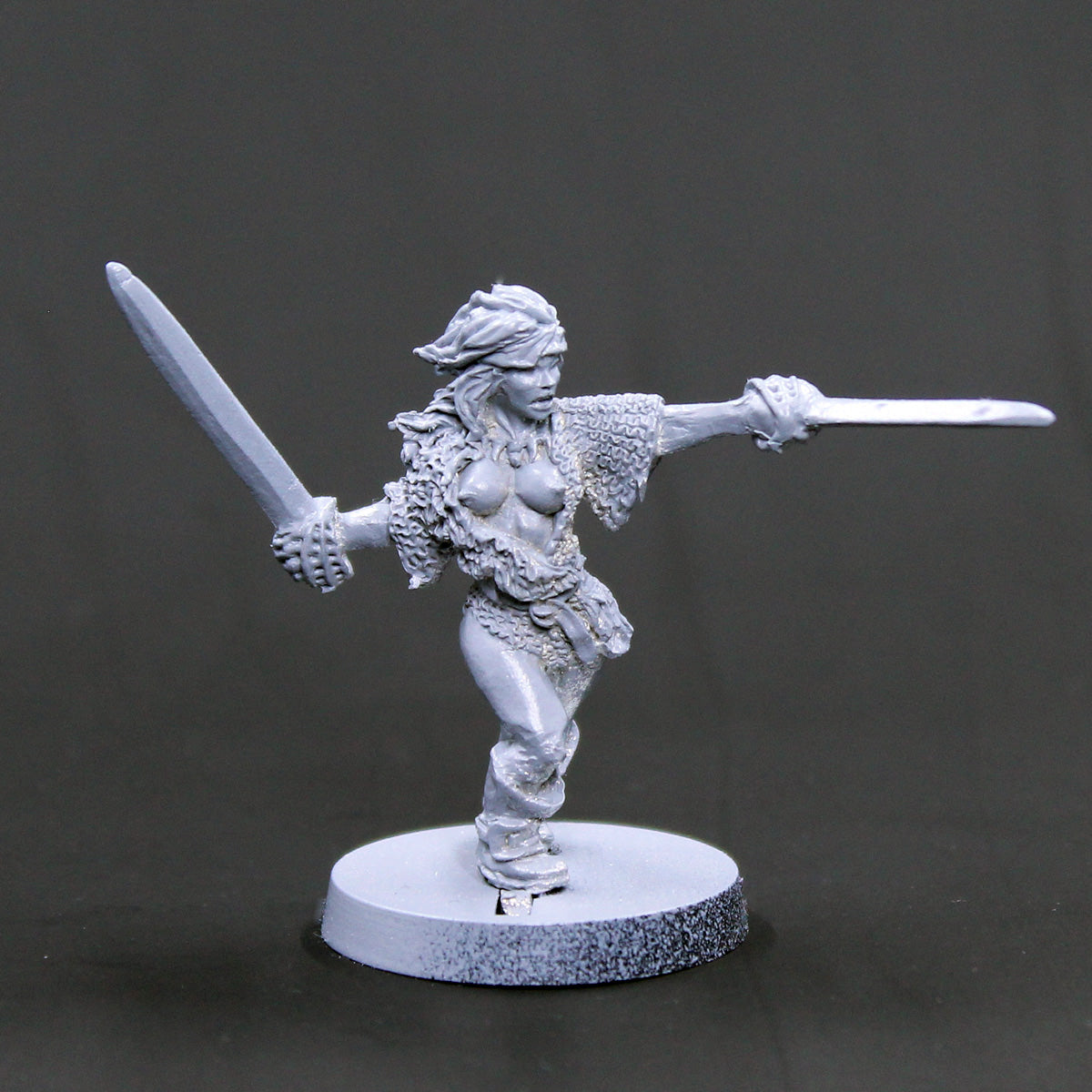 Khristine Female barbarian with two swords attacking
