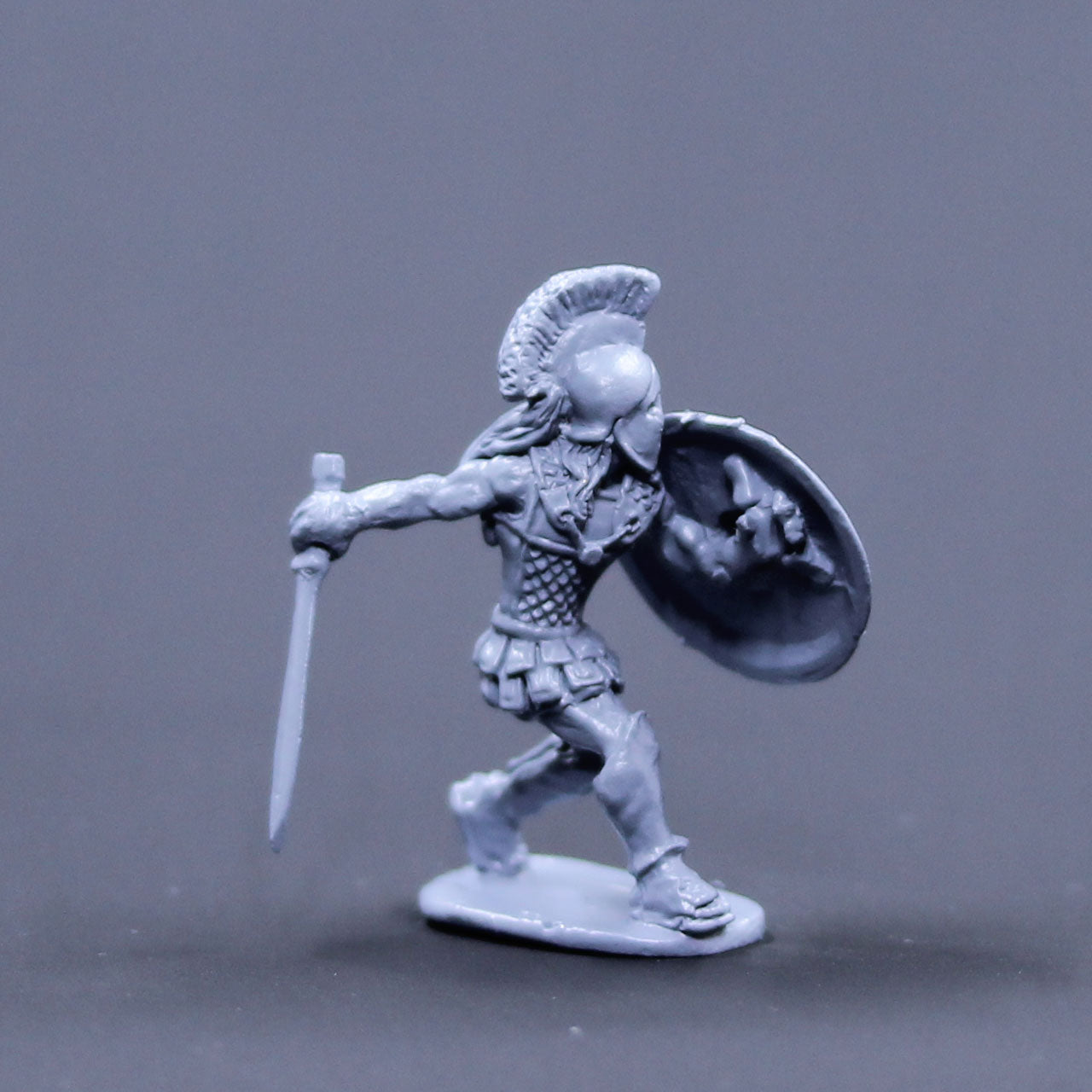 Greek armored defending with sword and shield