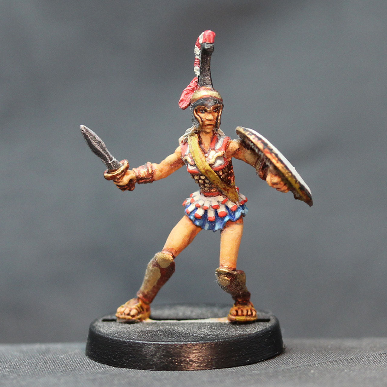 Amazon armored defending with sword and shield