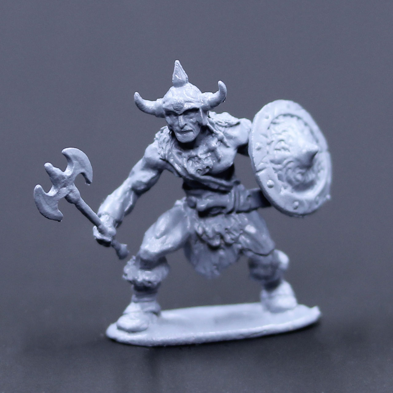 Barbarian armored advancing with axe and shield