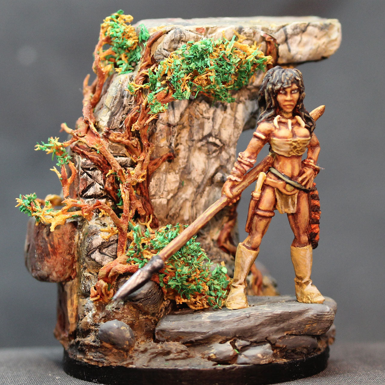 Dark skinned female warrior with spear