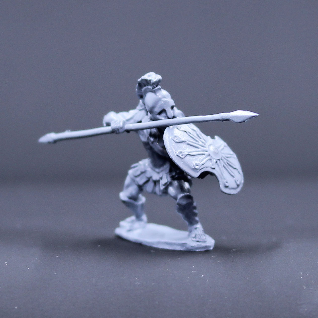 Greek armored defending with spear and shield