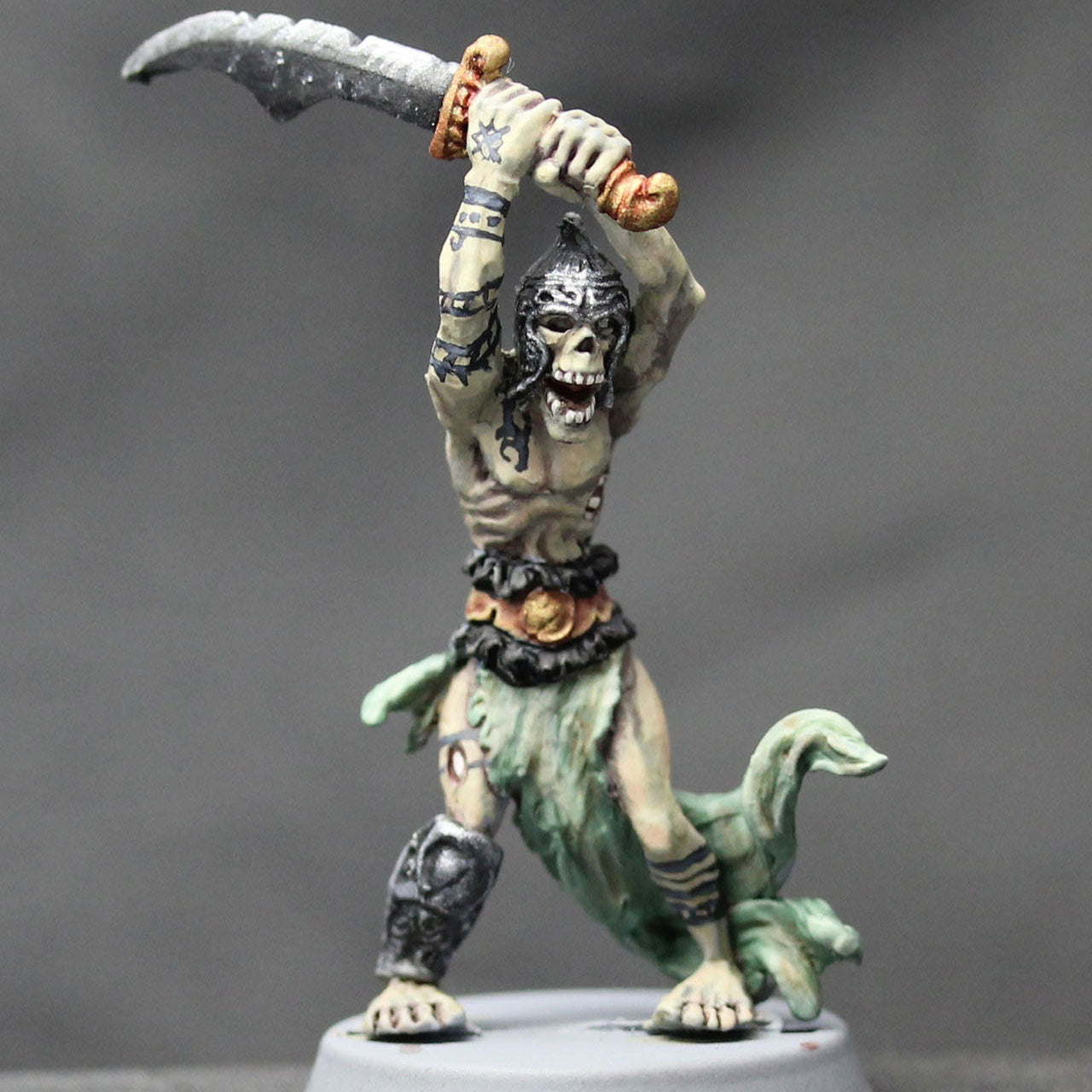 Undead barbarian armored attacking with great sword overhead